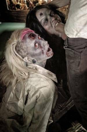 Fetish models Brittany Lynn and Jessie Lee giving head in Zombie threesome on dollser.com