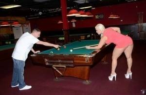 Curvy slut gets nailed on a pool table and jizzed over her big jugs on dollser.com
