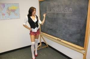 Naughty schoolgirl Cherry Poppins seduces a fellow student in slut wear on dollser.com