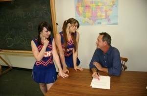 2 cheerleaders jerk off their geography teacher on top of his desk on dollser.com