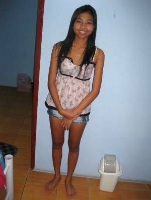 Stunning asian babe with shaved pussy gets undressed and slammed hardcore on dollser.com