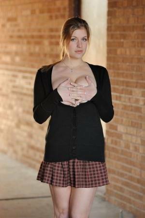 Amateur abbe letting big natural schoolgirl tits loose outdoors in socks on dollser.com