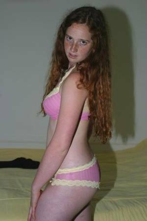 Flexible redhead Rachel showcases her natural pussy after lingerie removal on dollser.com