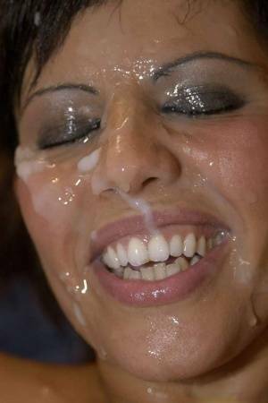Latina slut Scarlett March gets her face covered in sperm during a gangbang on dollser.com
