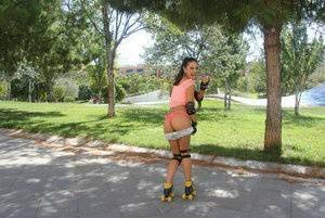 Latina solo girl Carolina Abril shedding shorts to expose nice ass outdoors on dollser.com
