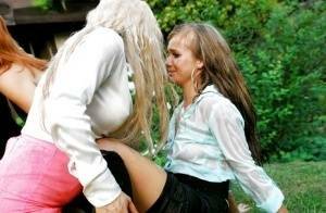 Lusty european sluts have some fully clothed pissing fun with a inky lad on dollser.com