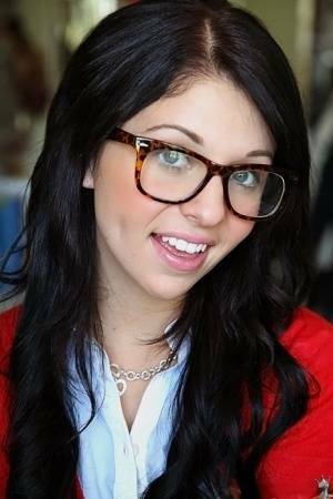Glasses on round face of cute girl Madelyn Monroe stress her tiny tits on dollser.com