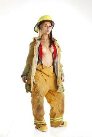 Skinny blonde babe is revealing her tremendous body in a fireman uniform on dollser.com