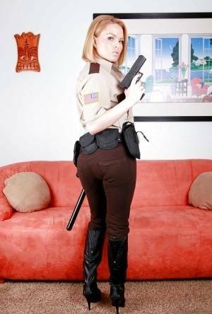 Hot babe in police uniform Krissy Lynn stripping and spreading her legs on dollser.com