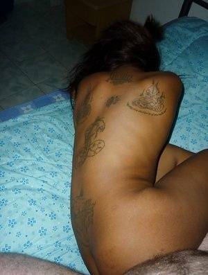 Tattooed Thai girl Nit getting banged bareback on bed by sex tourist - Thailand on dollser.com