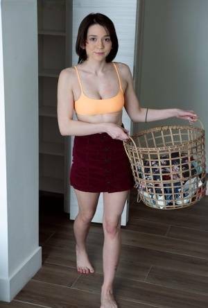 Young brunette Riley Jean makes her nude debut on a bed during laundry day on dollser.com