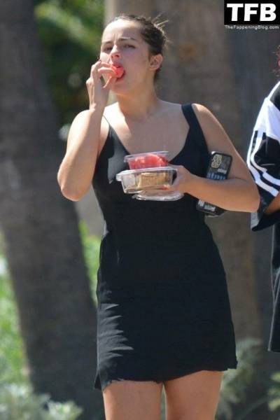 Addison Rae Indulges in Some Refreshing Watermelon While Out in a Tight Skirt with Her Boyfriend on dollser.com