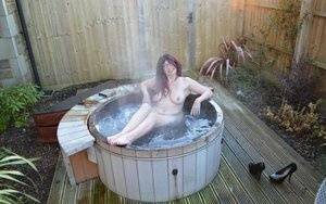 Amateur lady Barby Slut gets totally nude before getting in an outdoor hot tub on dollser.com