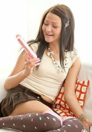 Cute teen slides a vibrator up her tight asshole wearing over the knee socks on dollser.com