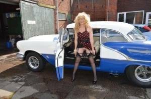 Blond amateur Barby Slut flashes by a vintage auto before sex at home on a bed on dollser.com