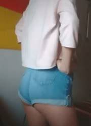 Cute blonde girl in shorts on dollser.com