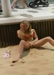 Horny teen masturbating at the beach on dollser.com