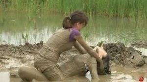 Two women have a romantic time in mud Thothub on dollser.com