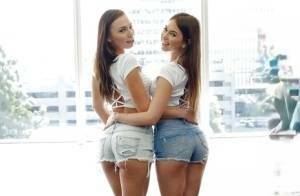 Teen pornstars Aidra Fox and Riley Reid suck each others lesbo tits and twats on dollser.com