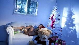 Hot girl Natasha Nice masturbates with a vibrator while alone at Christmas on dollser.com