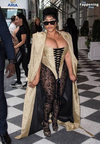 Lil’ Kim Flashes Her Areola as She Attends the Christian Siriano Fashion Show (32 Photos) - Usa on dollser.com